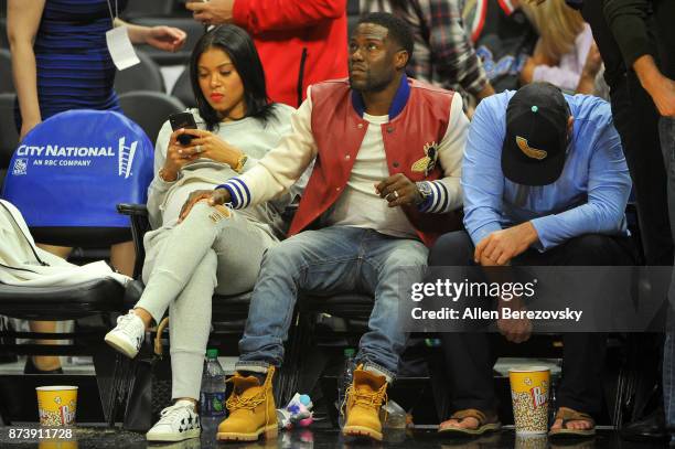 Actor Kevin Hart and wife Eniko Parrish attend a basketball game between the Los Angeles Clippers and the Philadelphia 76ers at Staples Center on...