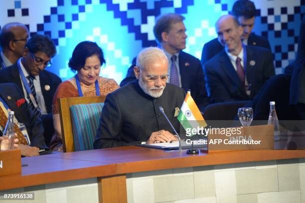 India's Prime Minister Narendra Modi participates in the East Asia meeting of the Southeast Asia Nations Summit on the sideline of the 31st...