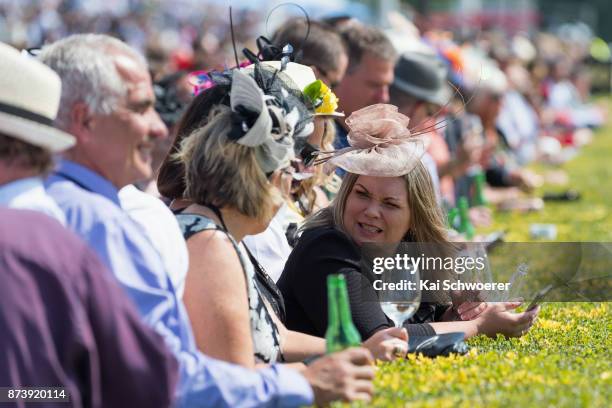 Racegoers enjoy the atmosphere during New Zealand Trotting Cup Day at Addington Raceway on November 14, 2017 in Christchurch, New Zealand.