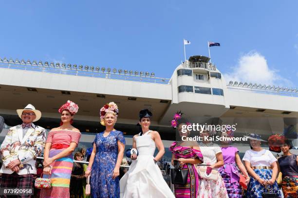 Competitors of the Best Dressed Lady and Best Dressed Man competitions look on during during New Zealand Trotting Cup Day at Addington Raceway on...