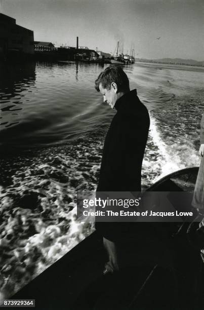 Portrait of Senator John F Kennedy , in an overcoat, as he stands in a boat in Coos Bay, Coos Bay, Oregon, 1959. He had just spoken at the...