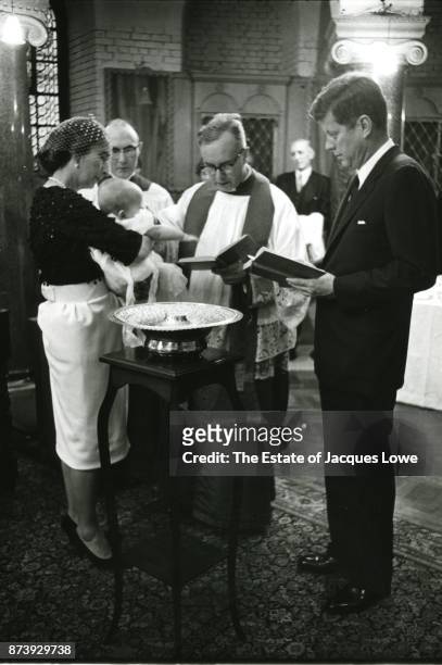 At Westminster Cathedral, English priest Gordon Wheeler conducts the baptism of Anna Christina Radziwill , held by her godmother Krystyna Radziwill,...