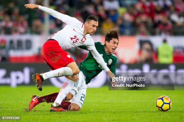 Omar Govea of Mexico fouled by Jaroslaw Jach of Poland during the International Friendly match between Poland and Mexico at Energa Stadium in Gdansk,...