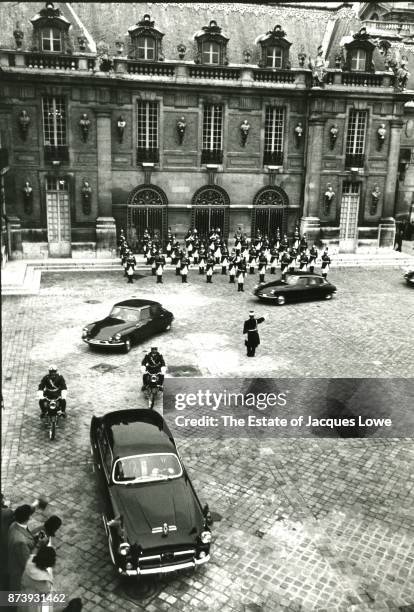 Elevated view of President Kennedy's motorcade as it arrives the Versailles Palace during a State Visit, Paris, France, June 1, 1961.