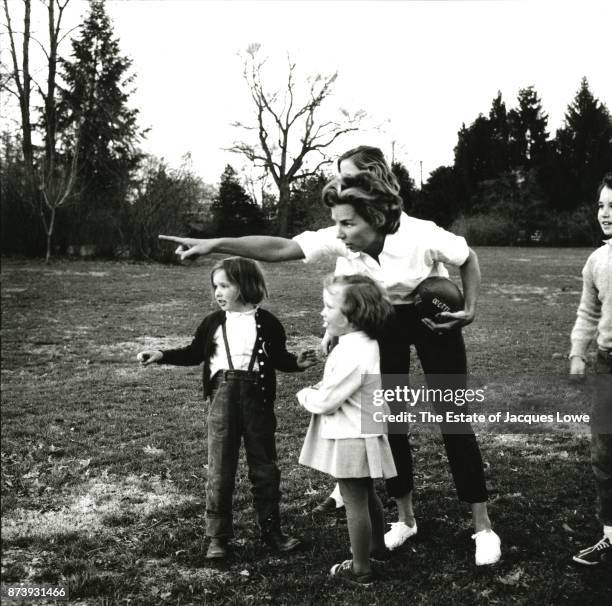 During a football game, Ethel Skakel Kennedy points out something to her team, made up of various Kennedy and neighborhood children, McLean,...