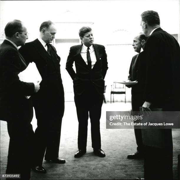 In the Oval Office, US President John F Kennedy meets with Deputy National Security Advisor Walt Whitman Rostow , US Secretary of the Treasury C...