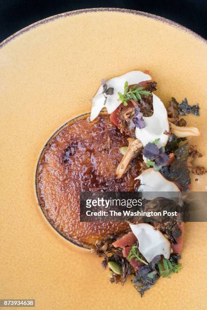 Kuri Squash Brûlée with maitake mushrooms, country ham, muscavado sugar spruce-shoot vinegar at Siren in Washington, DC on October 28, 2017.
