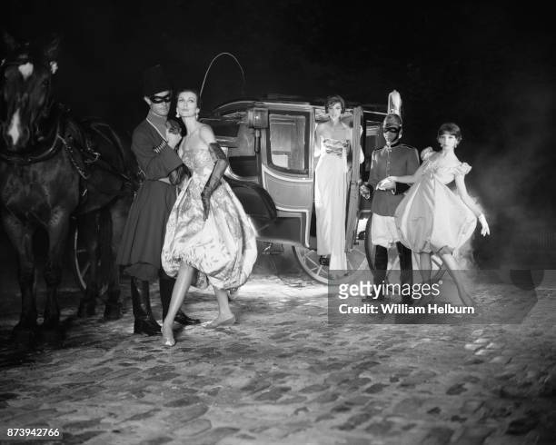 Accompanied by two, unidentified male models , from left, American models Carmen Dell'Orefice, Lucinda Hollingsworth, and Joanna McCormick pose by a...