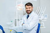 Kind hearted glance of professional dentist