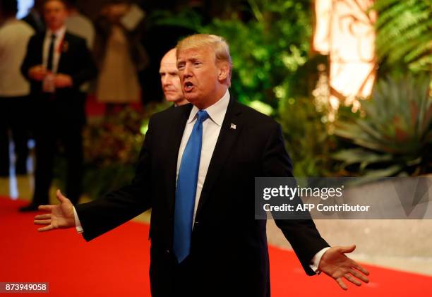 President Donald Trump talks to the press after attending the 31st Association of Southeast Asian Nations Summit in Manila on November 14, 2017. The...