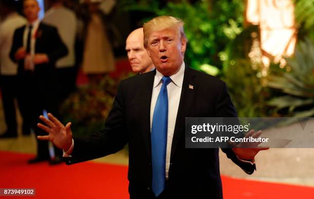 President Donald Trump talks to the press after attending the 31st Association of Southeast Asian Nations Summit in Manila on November 14, 2017. The...