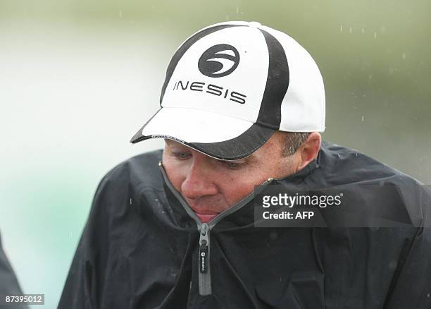 France's Thomas Levet pulls up his jacket during the third round of the Irish Open at Baltray in County Louth, Ireland, on May 16, 2009. Play has...