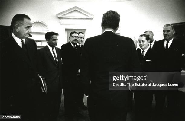 Along with his Vice President Lyndon Johnson , US President John F Kennedy meets with members of a congressional delegation in the Oval Office,...