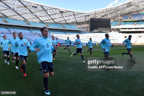 Members of Australia's football team take part in a training session in Sydney on November 14 ahead of their World Cup 2018 qualifying match against...