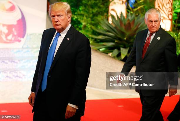 President Donald Trump , accompanied by US State Secretary Rex Tillerson, arrives to talk to the press after attending the 31st Association of...