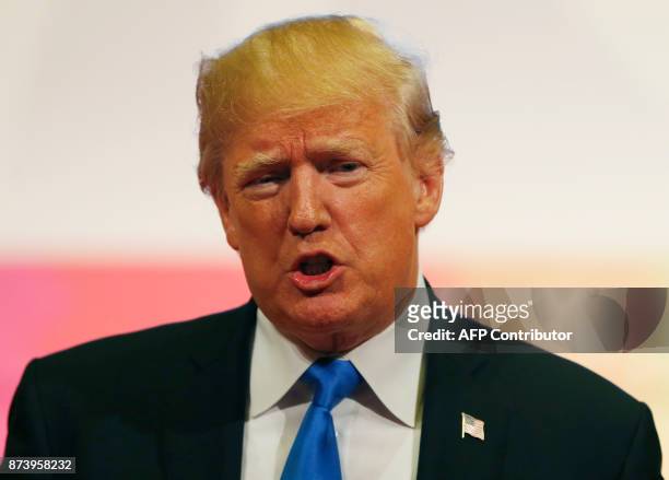 President Donald Trump talks to the press after attending the 31st Association of Southeast Asian Nations Summit in Manila on November 14, 2017. The...