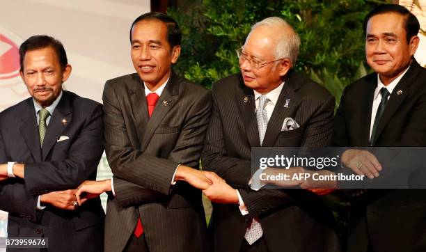 Brunei Sultan Hassanal Bolkiah, Indonesia President Joko Widodo, Malaysia Prime Minister Najib Razak and Thailand Prime Minister Prayut Chan-ocha...