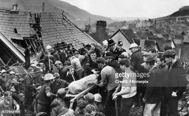 Aberfan 21st October 1966 For a moment the digging stops as another body is brought from the shattered Pantglas Junior School following the...