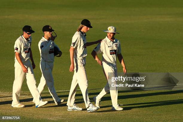 Jhye Richardson, Jonathan Wells, David Moody and Andrew Holder of Western Australia walk from the field at stumps during day two of the Sheffield...