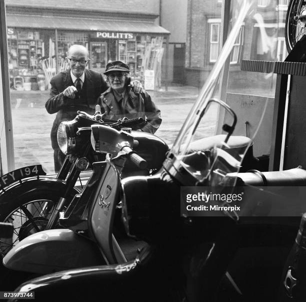 Florrie Ball and her brother Arthur Thompson looking in the window of the a motorbike shop, trying to pick a bike for Florrie, 11th February 1969.
