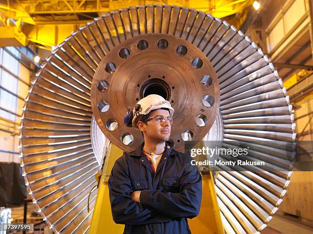 engineer in front of turbine - monty rakusen portrait stock pictures, royalty-free photos & images