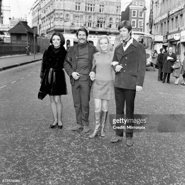 Film stars on a break during rehearsals for a Royal Film Performance of Franco Zeffirelli's film of Romeo and Juliet, on the left is Joan Collins and...