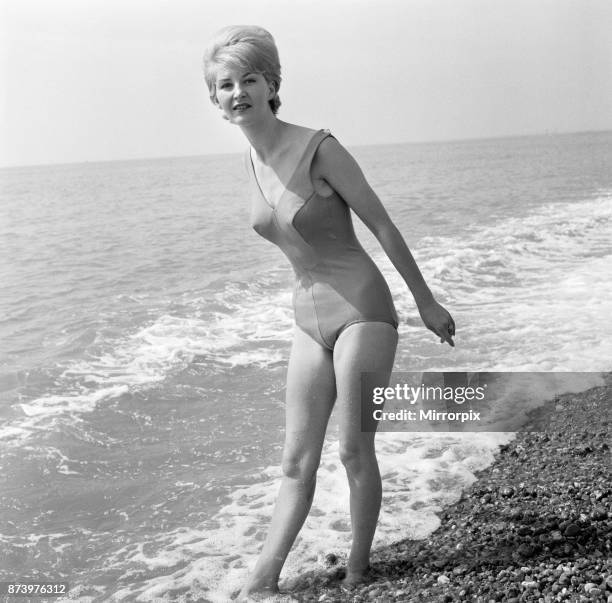 Summer sun brought out the seaside girls who wanted to catch the warm weather that has suddenly come to the coast. At Brighton, Angela Williamson...