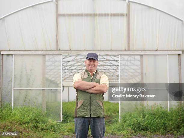 farmer standing outside polytunnel - tadcaster stock-fotos und bilder