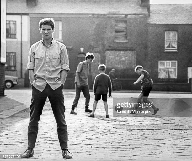 Blackpool and England footballer Alan Ball, part of the 1966 England squad, pictured in the stret wjhere his parents live in Walkden, Lancashire, 1st...