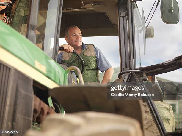farmer in tractor - tractor foto e immagini stock