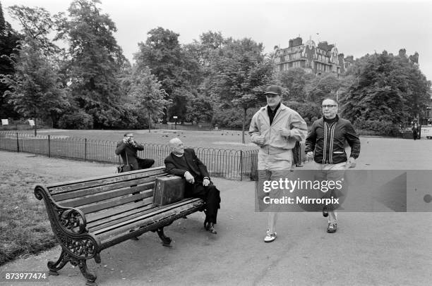 Dr Billy Graham, who has to keep fit for his London campaign trotted and walked in Hyde Park today. In sports gear which gave him the impression of a...