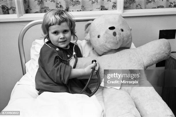 Little four year old Michelle Roberts and her big borrowed teddy bear were both progressing very nicely at Northampton General Hospital, after their...