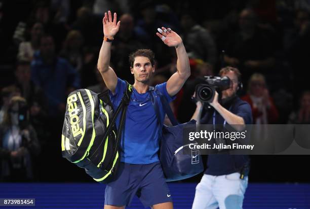 Rafael Nadal of Spain leaves the court after defeat in his Singles match against David Goffin of Belgium during day two of the Nitto ATP World Tour...