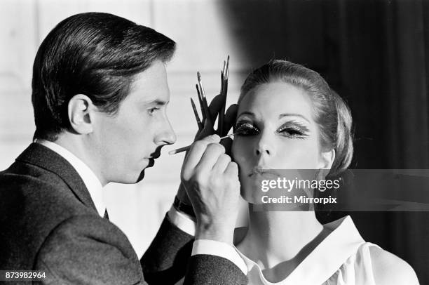 Pablo Manzoni, Eye Makeup Designer, described by Elizabeth Arden as The Picasso of Eye Makeup, demonstrates face makeup during press conference at...