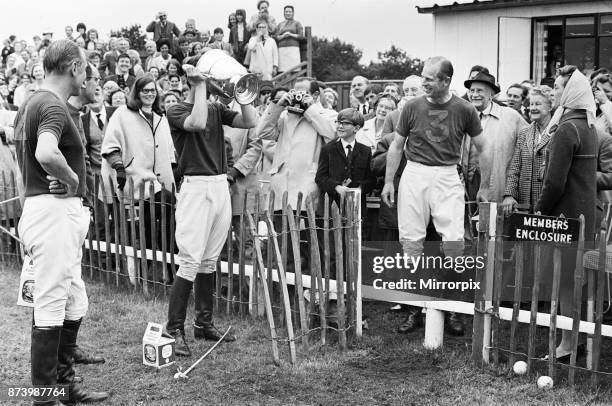 Prince Philip, his son Prince Charles and their polo team Windsor win the Junior County Championship at Little Bidworth, Cheshire following their 3...