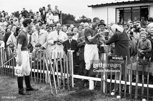 Prince Philip, his son Prince Charles and their polo team Windsor win the Junior County Championship at Little Bidworth, Cheshire following their 3...