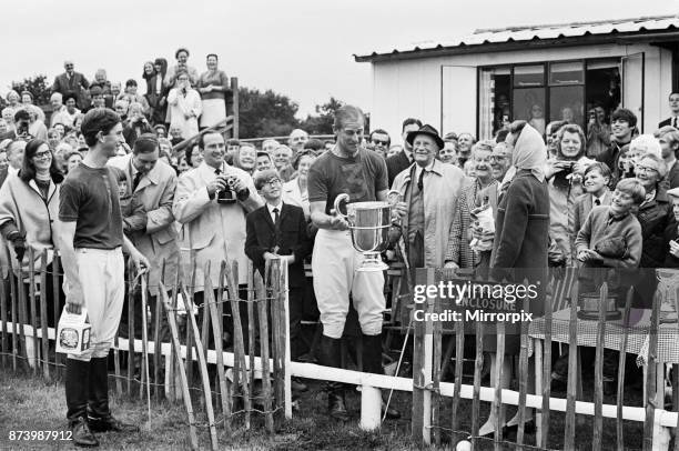 Prince Philip, his son Prince Charles and their polo team Windsor win the Junior County Championship at Little Bidworth, Cheshire following their 3...