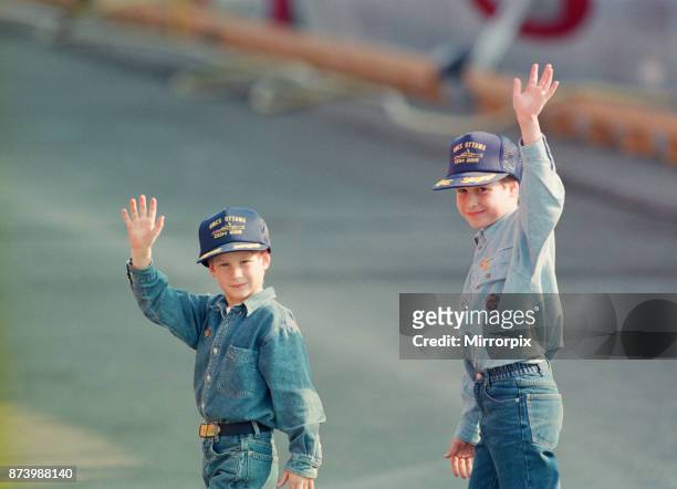 Prince Harry and Prince William wave to the cameras during their tour of Canada. They are in Canada with their parents, The Prince and Princess of...
