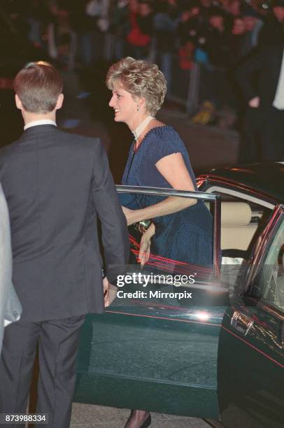 Princess Diana, Princess of Wales, arrives for the premiere of The Prince of Tides at Odeon Leicester Square, London in a stunning sapphire blue...