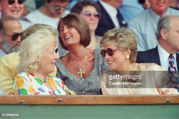 Princess Diana, Princess of Wales, attends the 1993 Men's Singles Wimbledon Tennis Final. She wears or attends to her sunglasses for most of the...