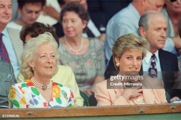 Princess Diana, Princess of Wales, attends the 1993 Men's Singles Wimbledon Tennis Final. She wears or attends to her sunglasses for most of the...