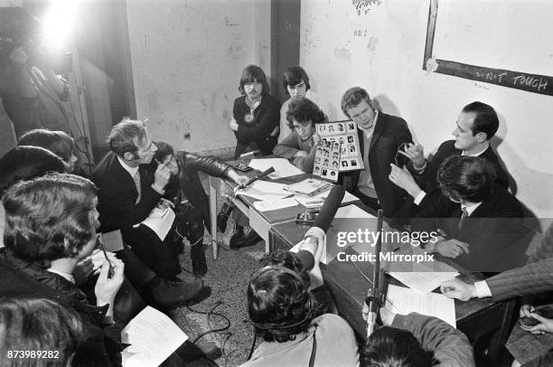 Provisional IRA meeting in Derry, Northern Ireland. Pictured, Martin McGuinness holding UVF photographs, to right is David O'Connell, 12th April 1972.