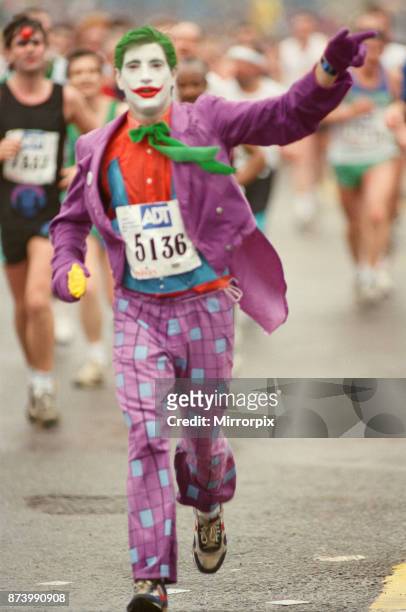 The London Marathon - 1990 Runners pass through and around the Tower Bridge area, run funnies, a runner dressed as The Joker from Batman, picture...
