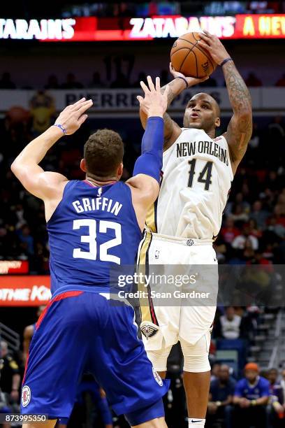 Jameer Nelson of the New Orleans Pelicans shoots over Blake Griffin of the LA Clippers during the first half at the Smoothie King Center on November...
