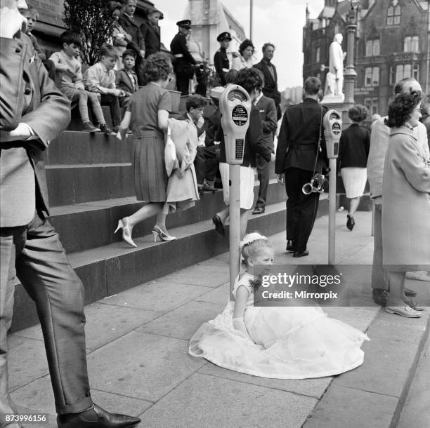 Manchester Church of England Whit Monday walks. Alison Lawson, aged 7, of Gay St Mission parks by this meter on the long long walk, 3rd June 1963.