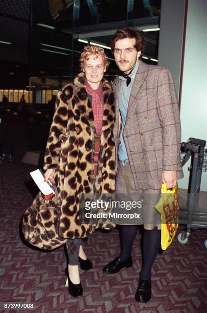 British fashion designer Vivienne Westwood with her assistant Andreas Kronthaler . Pictured at London's Heathrow Airport, heading to Paris, 20th...