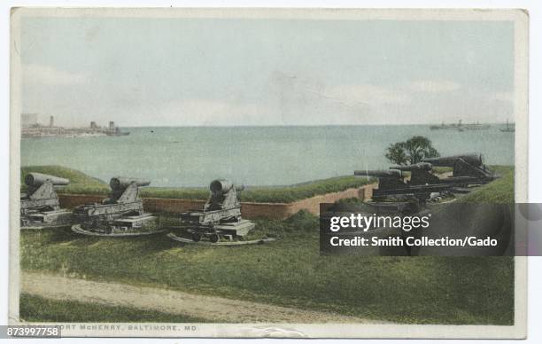 Cannons overlooking bay of water at Fort McHenry, Baltimore, Maryland, USA, 1914. From the New York Public Library.