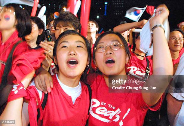 South Korean soccer fans celebrate despite watching their team lose the 2002 Federation Internationale de Football Association Korea-Turkey World Cup...