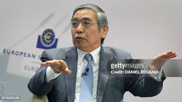 The governor of the Bank of Japan Haruhiko Kuroda speaks as he attends a conference titled "Communications Challenges for Policy Effectiveness"...