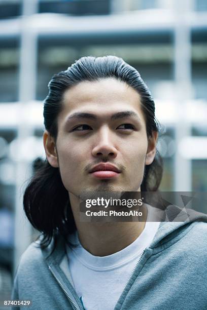 male with long hair and goatee looking away, portrait - asian man long hair stock pictures, royalty-free photos & images